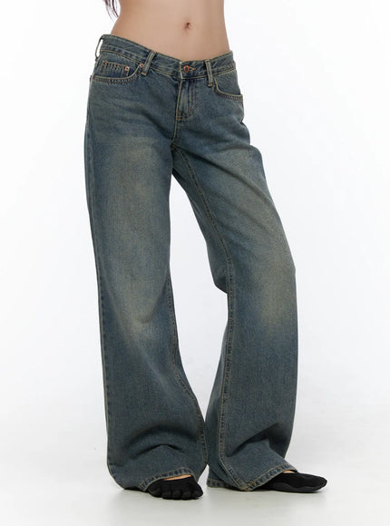 Cedar Vintage Wash Low-Rise Straight Jeans CL510 blue denim side shot on model from waist down showing wide-leg silhouette, faded wash and full leg length pooling at hem