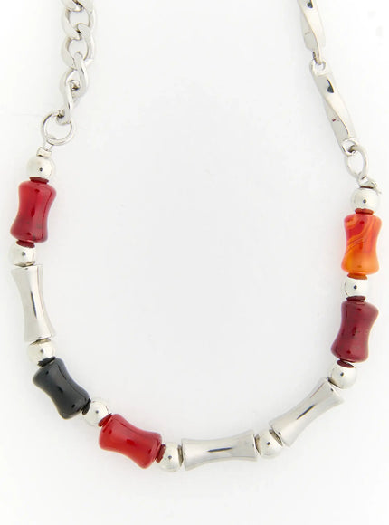 Celeste Link Necklace IL517 silver flat product shot showing full necklace with mixed red carnelian black and orange stone beads alternating with silver bamboo bar links