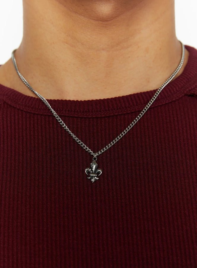 Chain Pendant Necklace IL509 silver close-up detail on model wearing burgundy ribbed crew-neck tee, fleur-de-lis crystal pendant