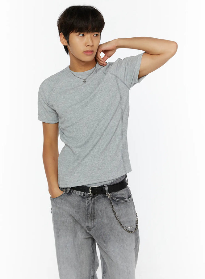 LEWKIN Chain Pendant Necklace IL509 silver front view on male model wearing grey ribbed tee and grey jeans, hand raised to neck
