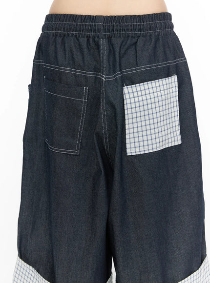 Check Back Pocket Jorts CL522 Dark blue back close-up detail showing elastic waistband, denim back pocket with white topstitching, and contrasting plaid check patch pocket