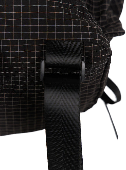 Checked Ribbon Backpack CL517 Black close-up detail of side strap buckle adjuster showing black grid check texture and black ribbon tie