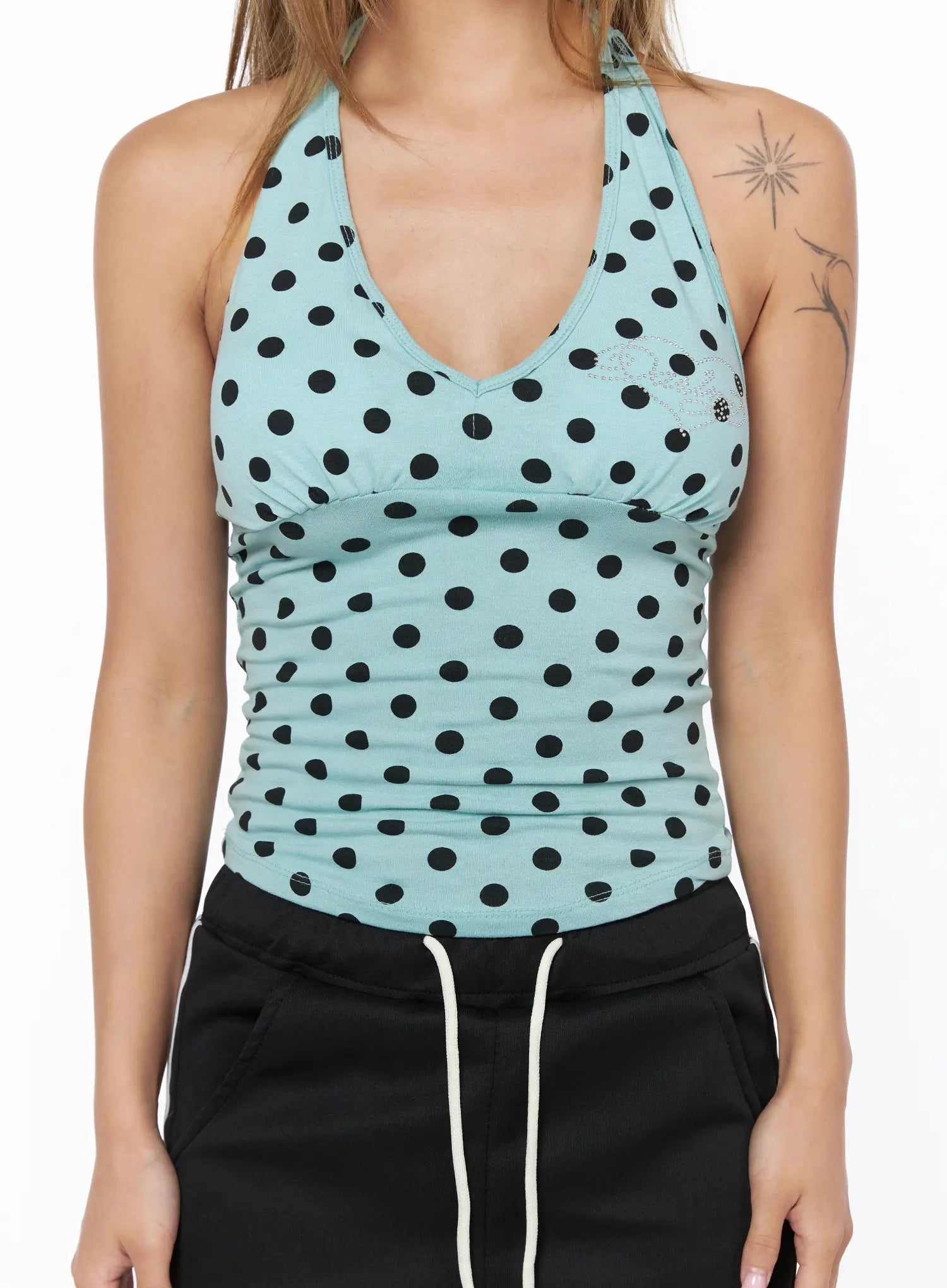 Chic Polka Dot Halter Top CU524 Mint close-up front detail shot on model showing V-neck, bust seam, rhinestone logo embroidery