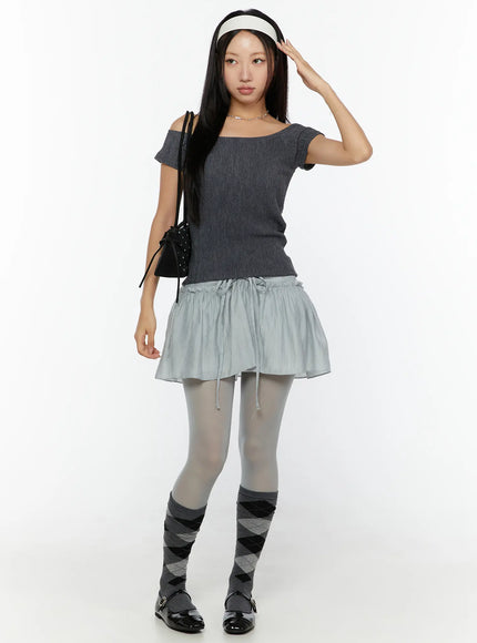 Chiffon Flare Mini Skirt CU526 Light blue full-body front shot on model styled with gray off-shoulder top, headband, and argyle socks