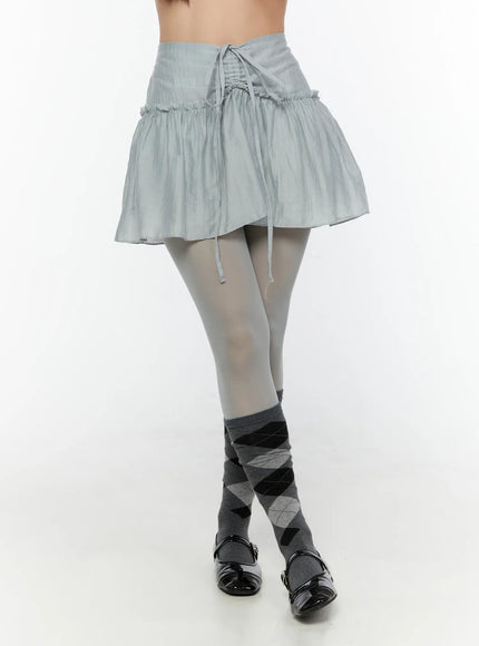 LEWKIN Chiffon Flare Mini Skirt CU526 Light blue front close-up on model showing drawstring corset waistband and ruffled flare hem with crinkle texture