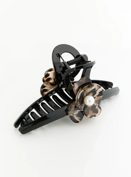 Chloe Flower Hair Clip IL503 Black angled side view flat-lay revealing spring hinge mechanism and layered leopard print flower with pearl