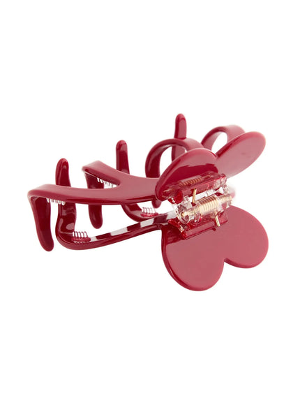 Clara Hair Clip IL503 burgundy red open clip detail view exposing dual heart panels gold coil spring hinge and serrated inner teeth