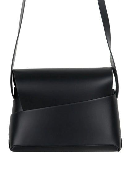 Classic Faux Leather Crossbody Bag IL523 Black close-up front product shot showing diagonal seam flap structured body and matte faux leather surface