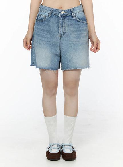 LEWKIN Classic Washed Jorts IU525 Blue front view on model Size S, faded denim shorts with raw frayed hem, worn with white socks and mary jane shoes