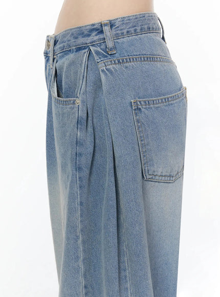 Coleen Side Pleat Baggy Jeans IL502 Blue close-up back detail of dual rear pockets waistband stitching and faded wash denim on model