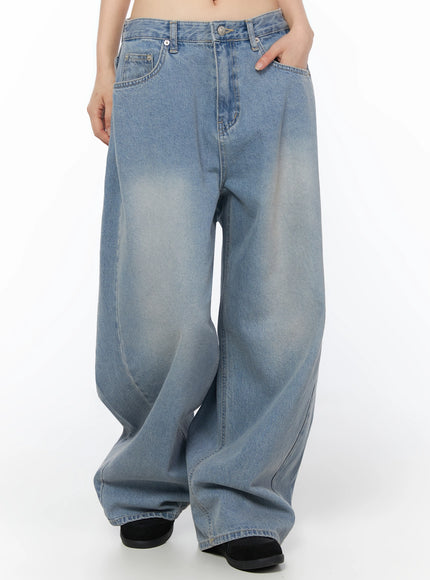 Coleen Side Pleat Baggy Jeans IL502 Blue front three-quarter view on model hand in pocket showing faded thigh wash and ultra-wide leg denim