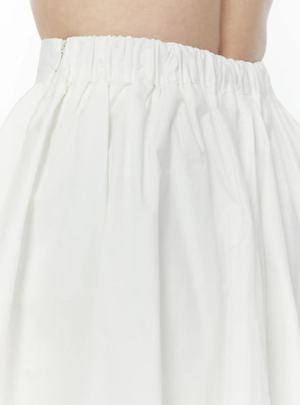Colette A-Line Midi Skirt IL506 White close-up detail of elasticated waistband with side zipper and gathered pleating at top of skirt
