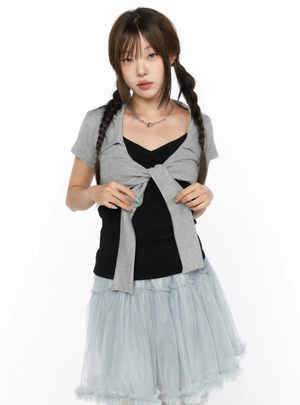 Collared Tie Short Sleeve Crop Bolero CL514 Gray front shot model wearing gray tie-front crop bolero open over black cami styled with blue tulle skirt