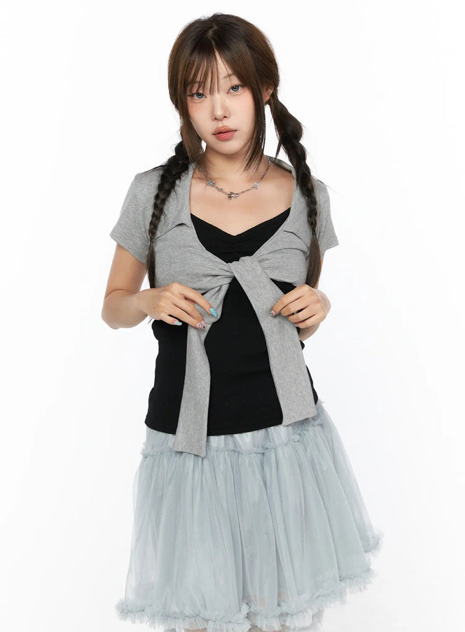 Collared Tie Short Sleeve Crop Bolero CL514 Gray front shot model wearing gray tie-front crop bolero open over black cami styled with blue tulle skirt