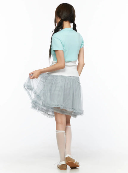 Collared Tie Short Sleeve Crop Bolero CL514 Mint back shot model lifting gray tulle skirt hem showing mint crop bolero back view with short sleeves and white underlayer