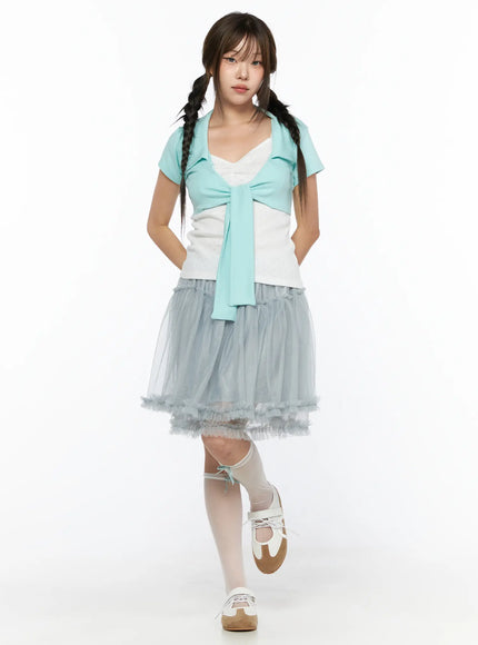 Collared Tie Short Sleeve Crop Bolero CL514 Mint front full-body shot model standing wearing mint tie-front crop bolero over white top with gray tulle skirt and white knee socks