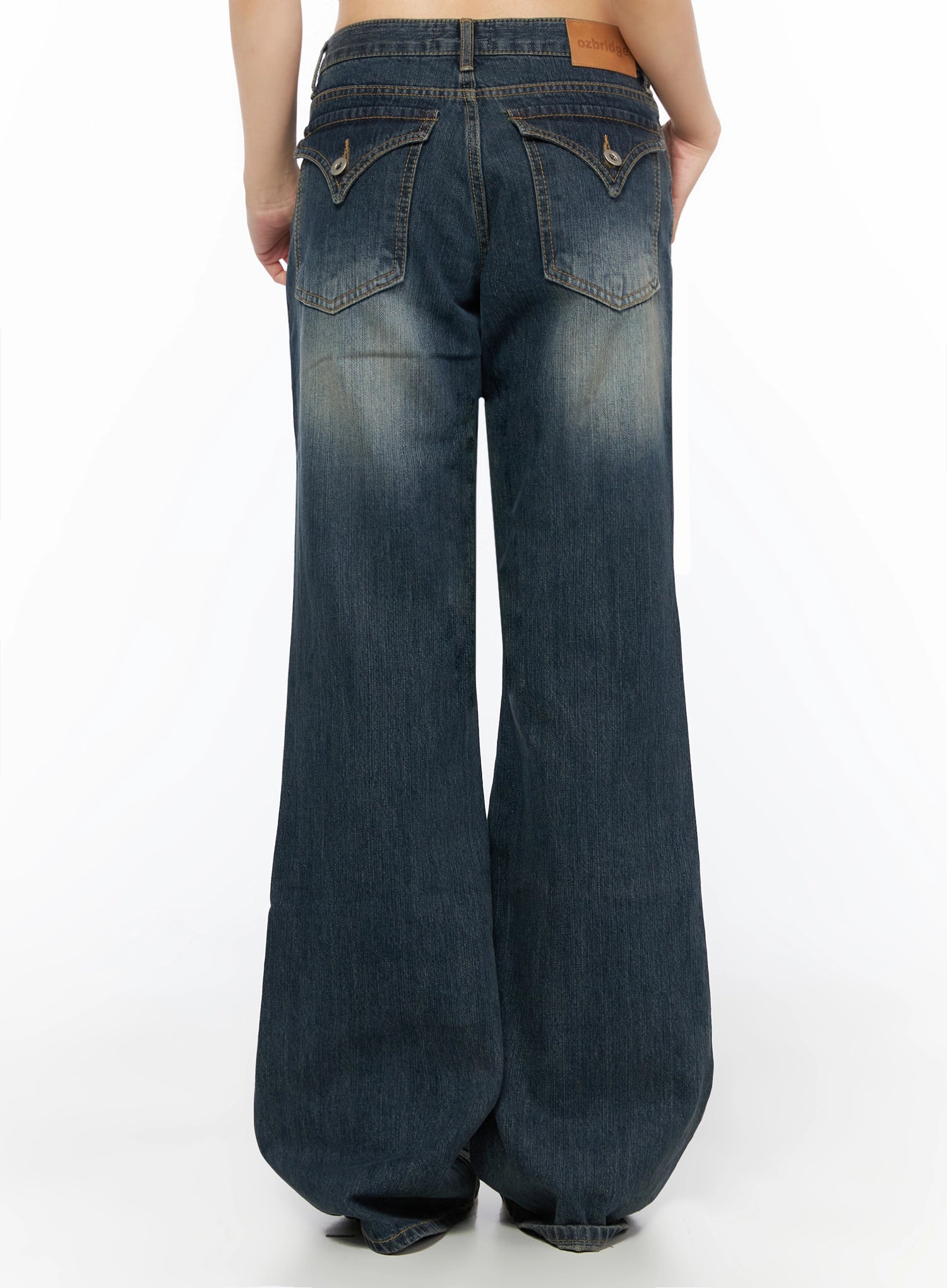 Collins Vintage Washed Bootcut Jeans IL523 Dark blue back view on model showing full-length wide bootcut flare vintage wash and ozbridge leather patch label at waist