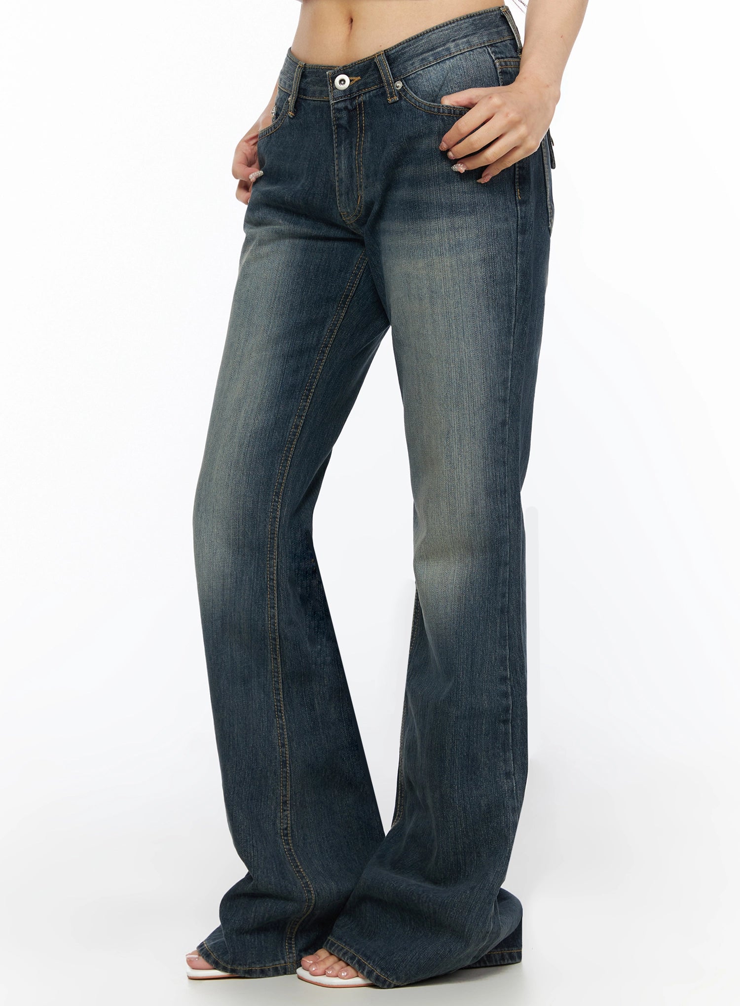 Collins Vintage Washed Bootcut Jeans IL523 Dark blue side shot on model showing low-rise fit hand in pocket V-shaped waistband and flared bootcut leg silhouette