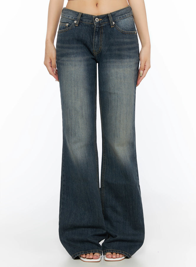 LEWKIN Collins Vintage Washed Bootcut Jeans IL523 Dark blue front shot on model cropped at waist showing low-rise waistband button closure and wide flared leg hem