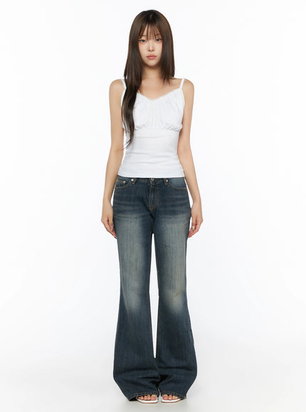 Collins Vintage Washed Bootcut Jeans IL523 Dark blue full-body front shot model in white lace cami top arms at sides standing straight showing full length flare