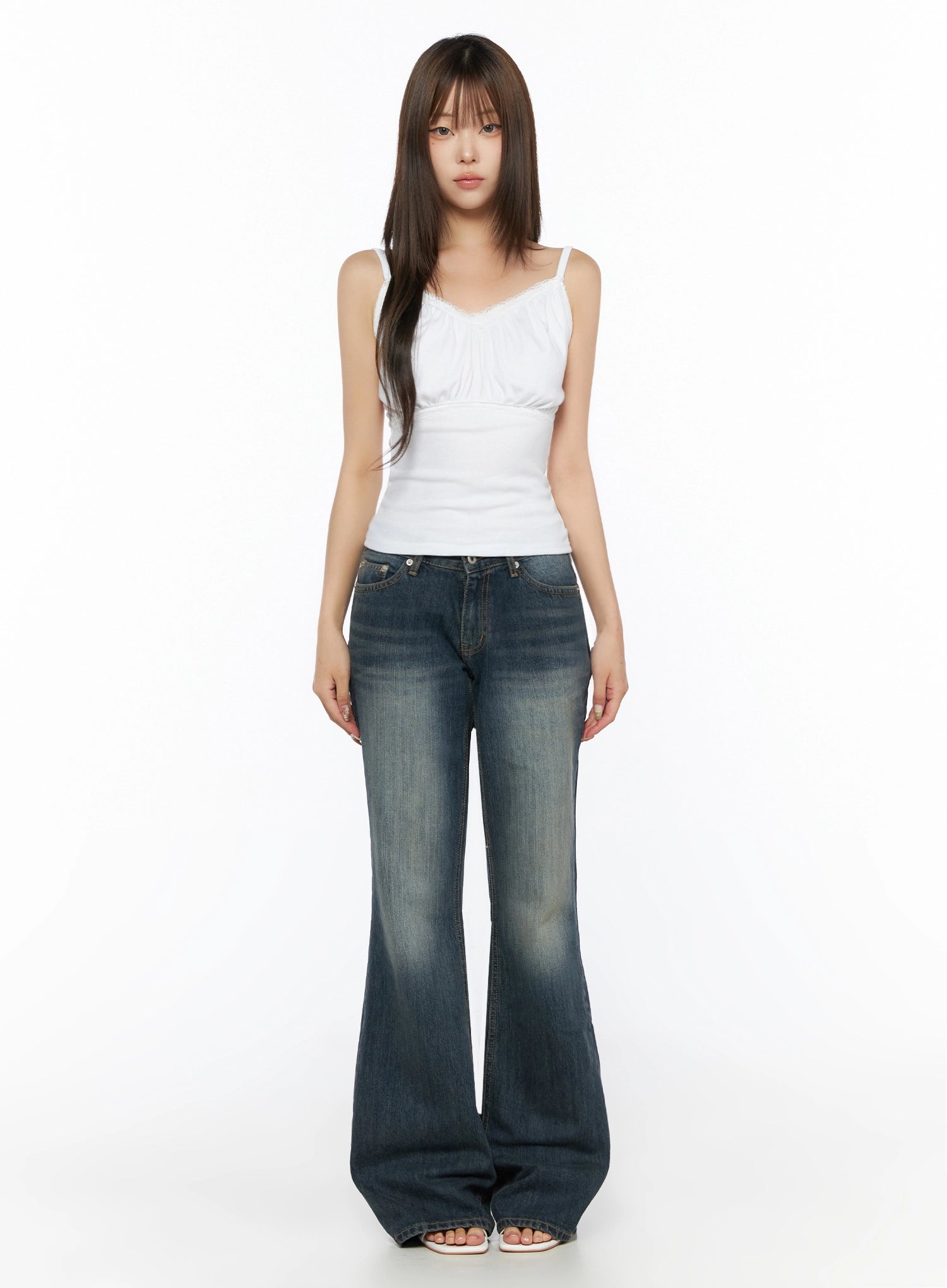 Collins Vintage Washed Bootcut Jeans IL523 Dark blue full-body front shot model in white lace cami top arms at sides standing straight showing full length flare