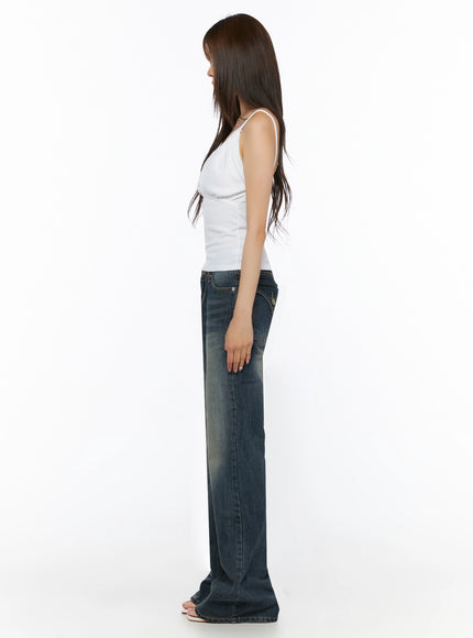 Collins Vintage Washed Bootcut Jeans IL523 Dark blue side shot model in white cami top profile view showing low-rise rise slim thigh and bootcut flare to floor