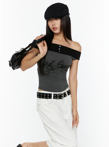 LEWKIN Color Contrast Off-Shoulder Graphic Top CU529 Dark gray S/M front model shot 3/4 angle with black baker boy cap and leather bag butterfly print striped crop top