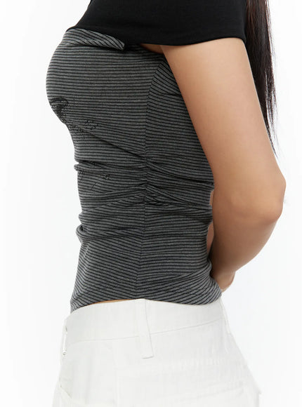 Color Contrast Off-Shoulder Graphic Top CU529 Dark gray close-up side model shot highlighting ruched ribbed striped knit fabric texture and fitted silhouette from waist to shoulder