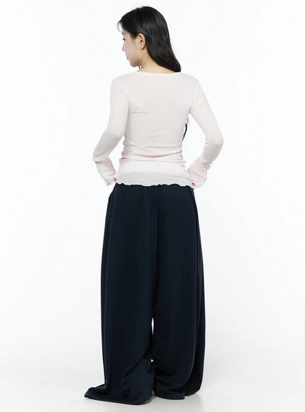 Color Contrast Wide-Leg Sweatpants IU525 Dark blue back view on model in pink long-sleeve top, white contrast elastic waistband, oversized wide-leg drape