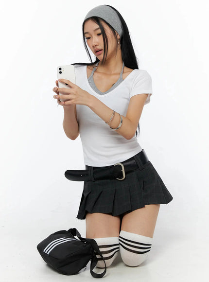 Contrast Ring Halter Layered Top IL516 White kneeling shot model looking at phone gray headband layered tee with black belt bag street accessories