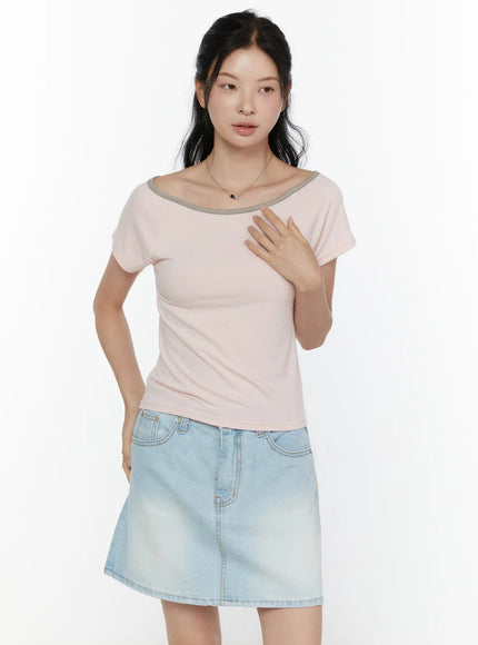 Contrast Trim Boat Neck Tee CL521 Light pink close-up front shot on model highlighting grey contrast boat neckline trim and slim soft-knit fit