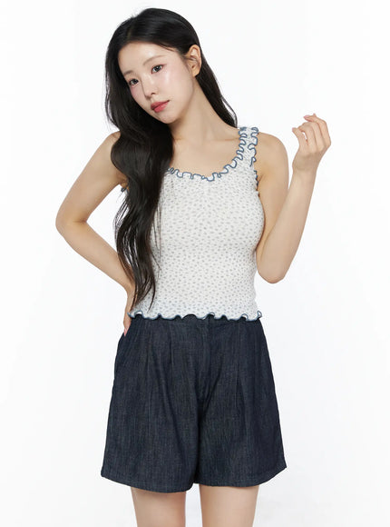 Contrast Trim Floral Tank Top IU525 Light beige front model shot model raising hand to hair styled with white crossbody bag dark denim shorts and hair clip