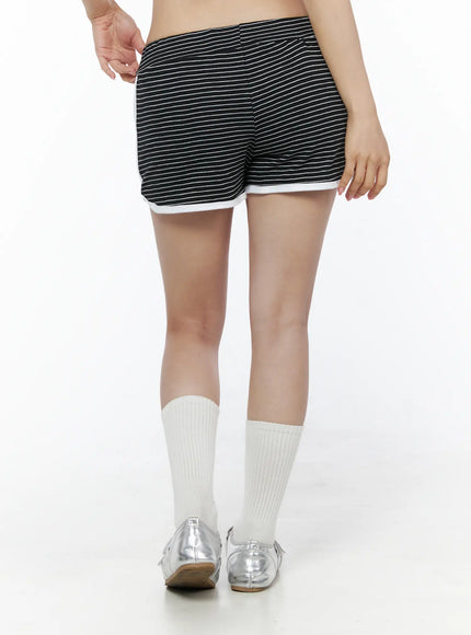 Contrast Trim Striped Shorts IU525 Black back view close-up on model showing rear panel horizontal stripes and white contrast hem trim