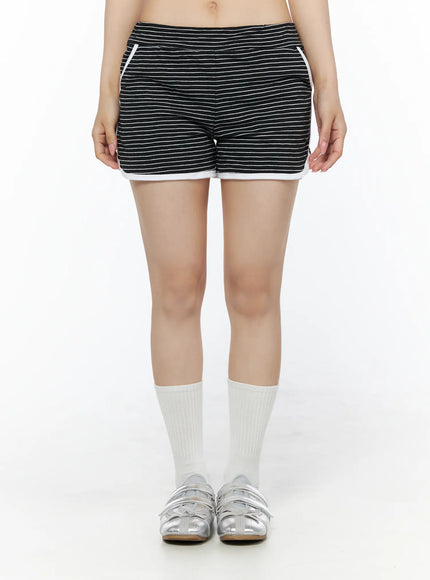 LEWKIN Contrast Trim Striped Shorts IU525 Black front close-up on model showing horizontal stripe pattern and white contrast trim hem