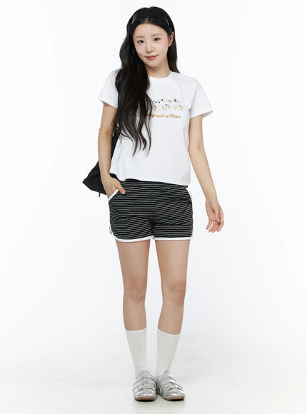 Contrast Trim Striped Shorts IU525 Black full-body front shot on model styled with white graphic tee white socks and silver sandals