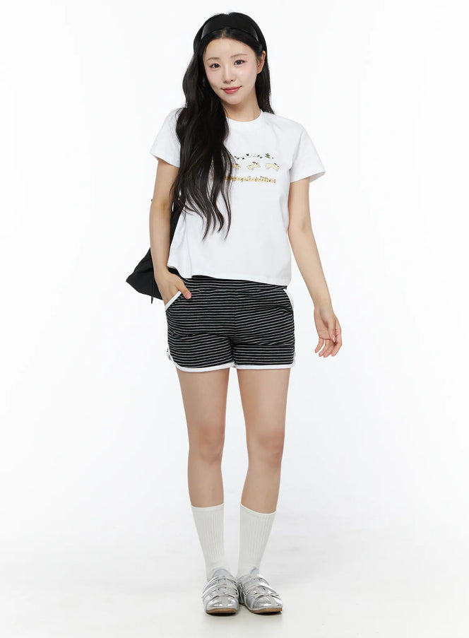 Contrast Trim Striped Shorts IU525 Black full-body front shot on model styled with white graphic tee white socks and silver sandals