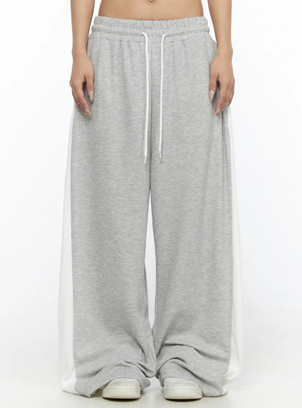 LEWKIN Contrast Wide-Leg Sweatpants CL528 Gray front view on model cropped at waist showing white drawstring elastic waistband and side contrast panels