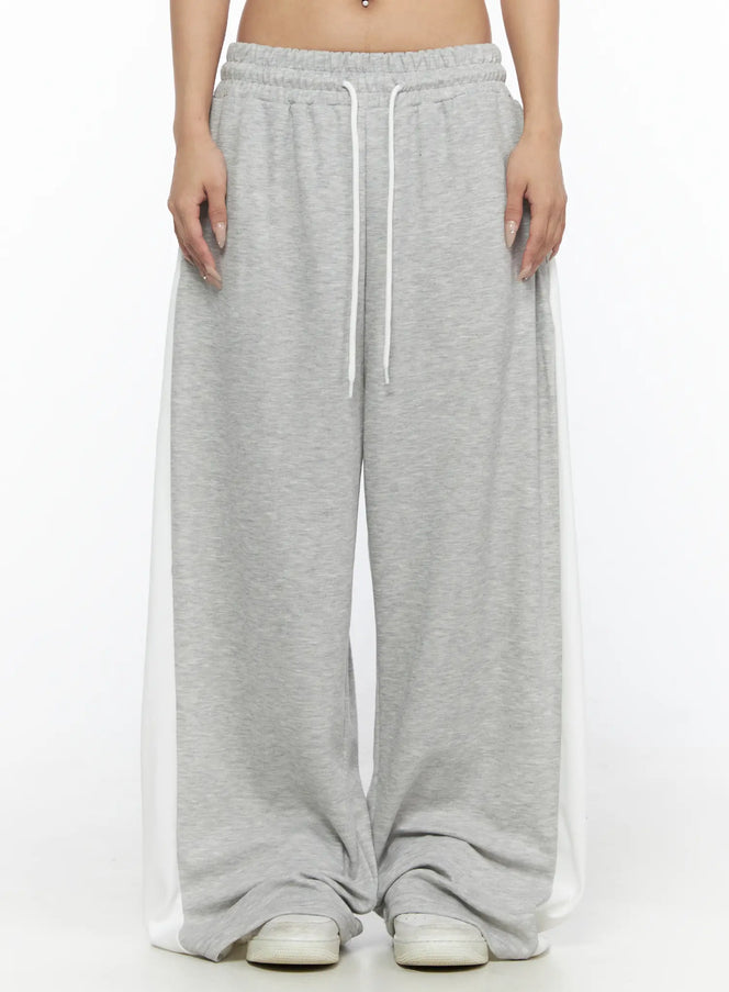 LEWKIN Contrast Wide-Leg Sweatpants CL528 Gray front view on model cropped at waist showing white drawstring elastic waistband and side contrast panels
