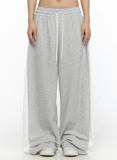 LEWKIN Contrast Wide-Leg Sweatpants CL528 Gray front view on model cropped at waist showing white drawstring elastic waistband and side contrast panels