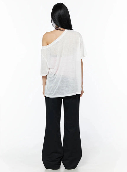 Corset Graphic Off-Shoulder Oversized Tee IL516 White back shot model standing sheer plain back off-shoulder drop shoulder seam semi-transparent fabric black flare pants