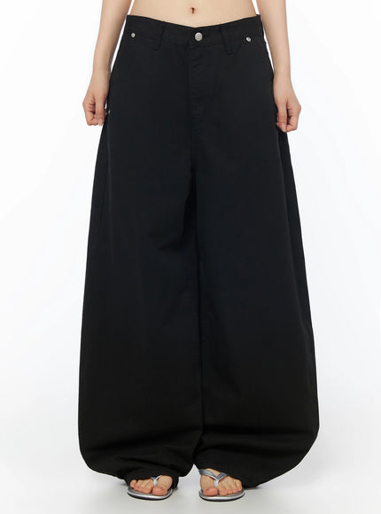 LEWKIN Cotton Balloon Pants IL502 Black front view on model wearing silver sandals, extreme wide-leg balloon silhouette, low-rise waistband with silver button