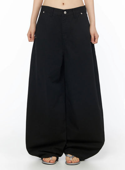 LEWKIN Cotton Balloon Pants IL502 Black front view on model wearing silver sandals, extreme wide-leg balloon silhouette, low-rise waistband with silver button