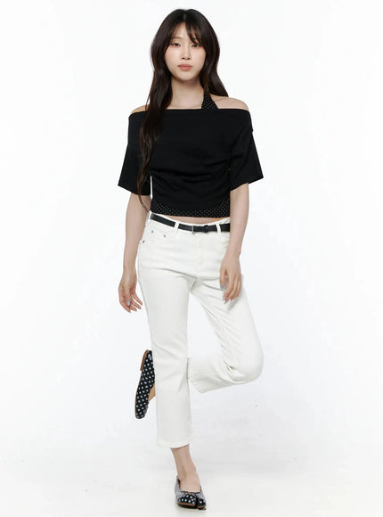 Cotton Capri Trousers IL506 White full-body front shot on model with dynamic leg-raise pose, black off-shoulder top, black belt, polka-dot flats