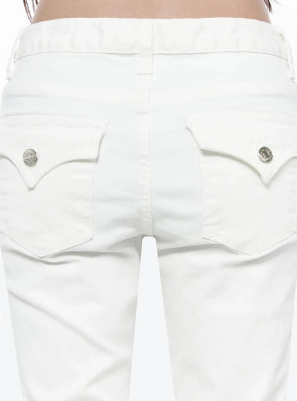 Cotton Capri Trousers IL506 White close-up back detail of curved double-flap pockets with silver engraved snap buttons and denim texture
