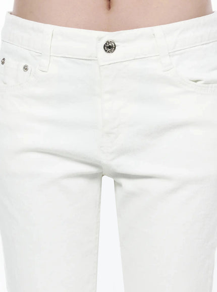 Cotton Capri Trousers IL506 White close-up front detail showing silver snap button, coin pocket rivets, low-rise waistband and denim texture