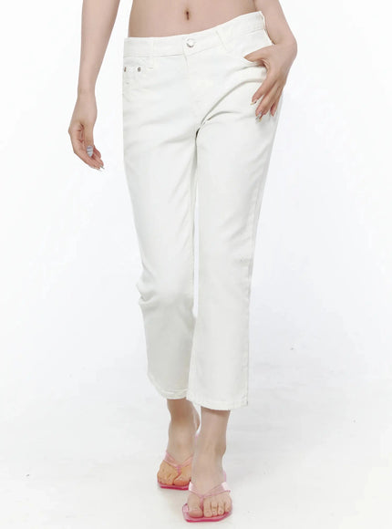 Cotton Capri Trousers IL506 White front view on model waist-down angled pose, hand in pocket, silver hardware, pink flip-flops, crop length