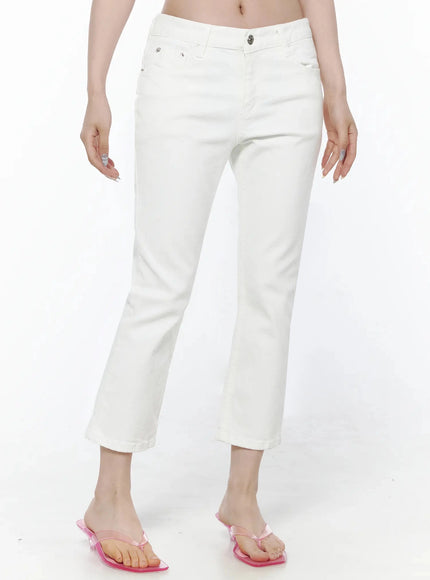 Cotton Capri Trousers IL506 White front waist-down shot on model showing front pockets, silver button, straight crop leg, pink transparent heels