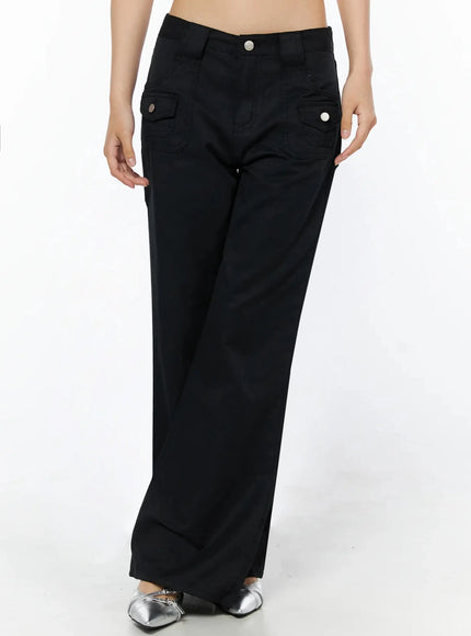 LEWKIN Cotton Pocket Bootcut Pants IL516 Black front view on model size S, wide-leg silhouette with silver button flap pockets, silver mule shoes