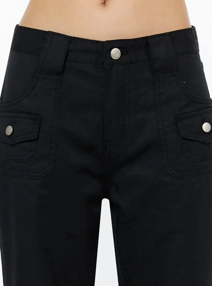 Cotton Pocket Bootcut Pants IL516 Black close-up detail of front waistband, silver center button, dual flap pockets with silver snap buttons