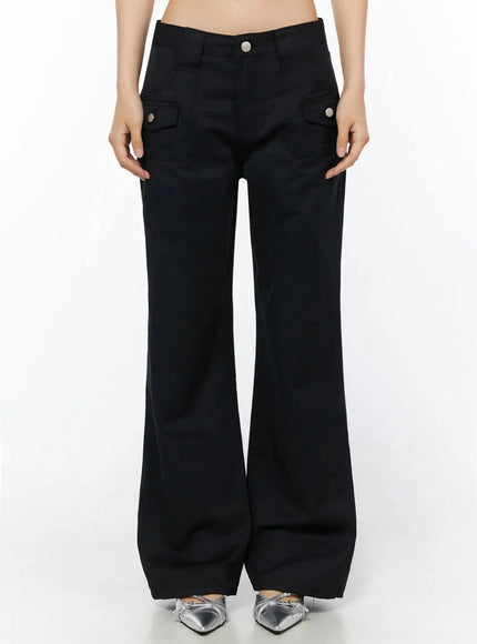 Cotton Pocket Bootcut Pants IL516 Black front model shot from waist down, flap cargo pockets with silver snaps, flared hem, silver shoes